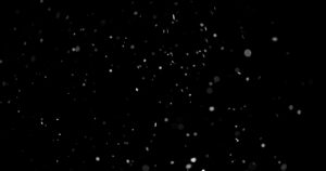 استوک فوتیج گرد و غبار Dust Particles Against Black